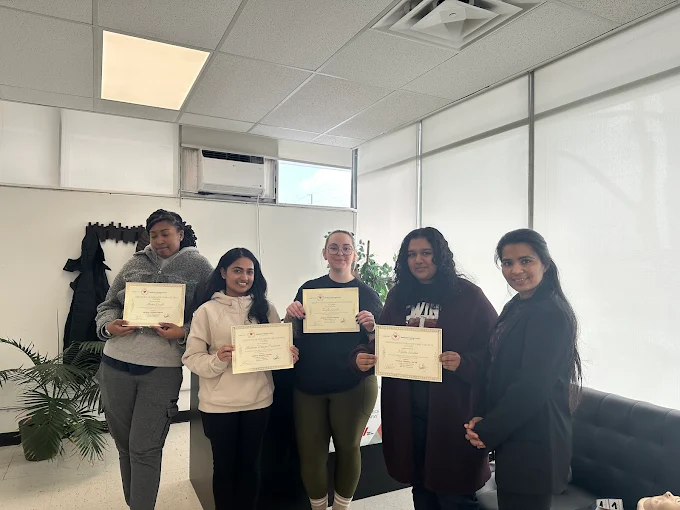 Group of Medical Training Center students holding their course certificates